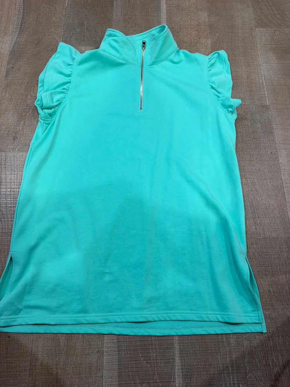 SSYS collared quarter zip with cute ruffle sleeves.